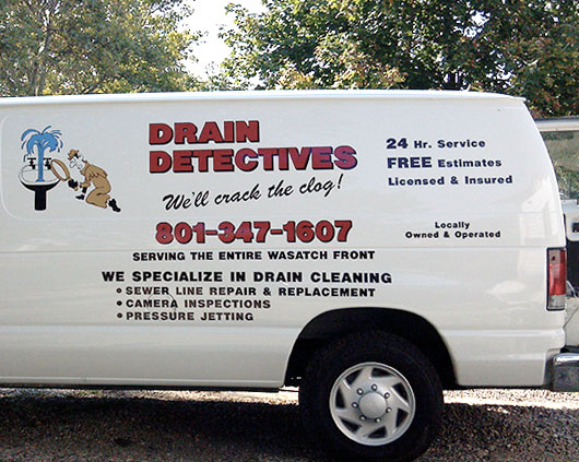 Owner standing next to Drain Detectives service van